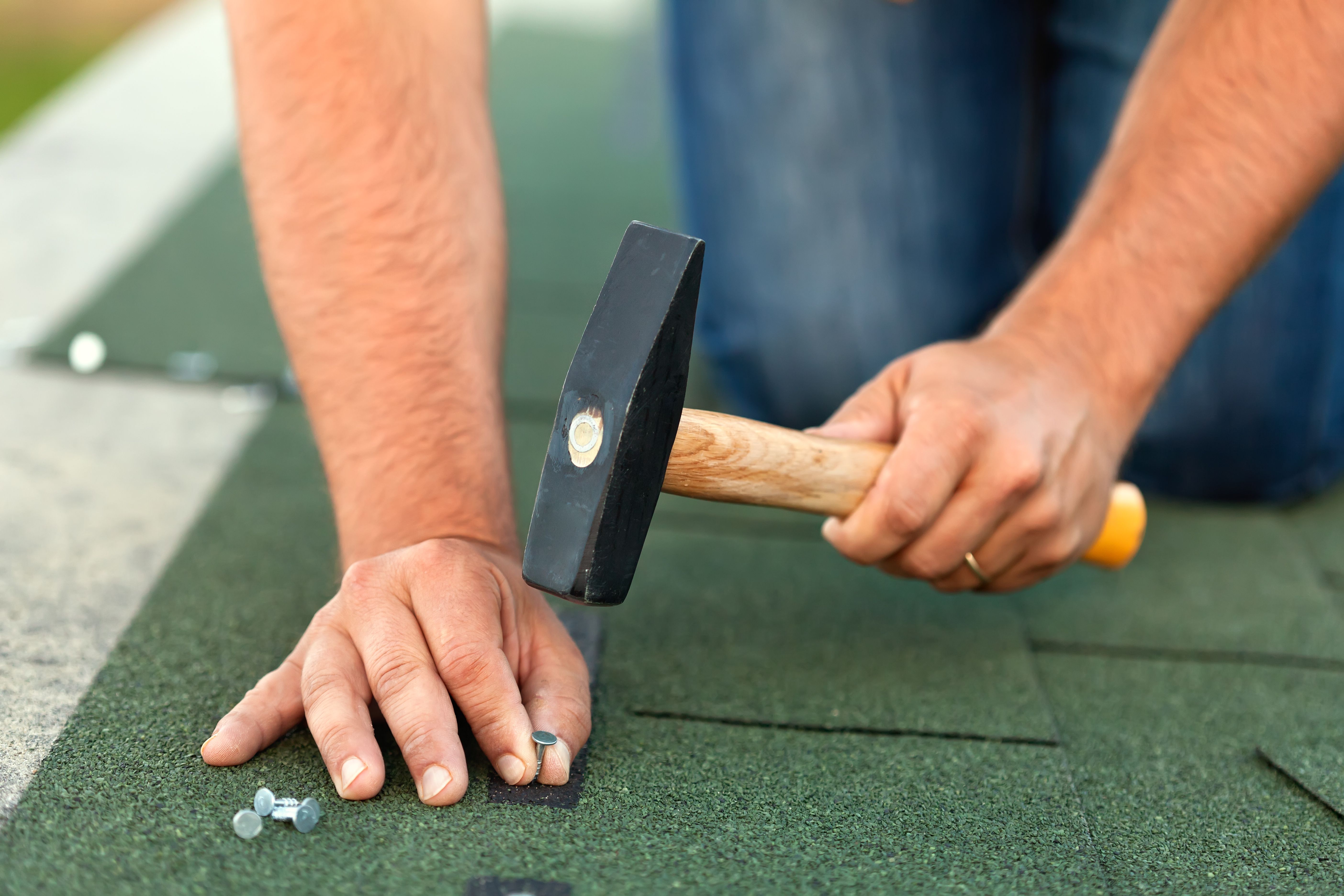 tacking down asphalt shingles